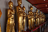 Bangkok Wat Pho, Buddha gilded statues lined in the double cloister enclosing the ubosot.  